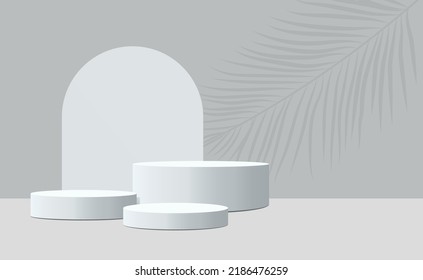 vector of three empty podiums of different heights. gray podiums on a gray background with a round arch in the background
