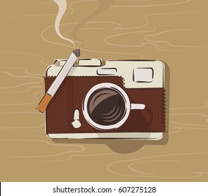 Vector  top view of coffee mug and cigarette on a table forming retro camera 