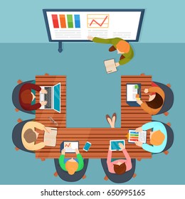 Vector top view illustration in flat style of people sitting and working with laptops and documents, watching presentation on screen.