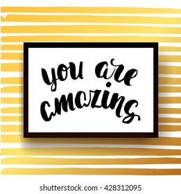 Vector trendy hand lettering poster. Hand drawn calligraphy ' you are amazing ' Template poster on gold lines