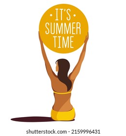 vector trendy illustration on the theme of summer holidays. a tanned girl in a yellow swimsuit sits on the beach and holds a huge inflatable ball with the text "it's summer time" on outstretched arms.