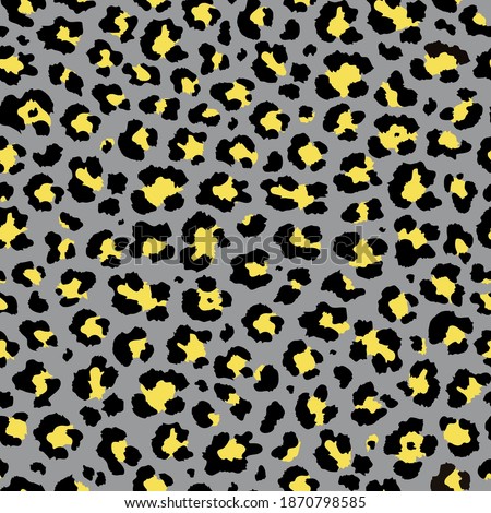 Vector trendy yellow and gray colors leopard seamless pattern. Abstract ornament of cheetah or ounce predatory print. Modern animal fur fashion background. Exotic wild leopard animal skin pattern.