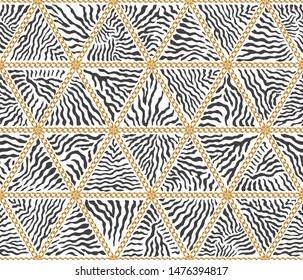 Vector Triangular patchwork seamless pattern from Zebra stripes and Baroque golden chains. Black and white animal print background.Batik paint, wallpaper décor, textile patch, wrapping paper, web page