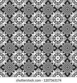 Vector tribal design in white, gray and black colors. Hand drawn seamless pattern. For textile, wallpaper, wrapping paper. Ethnic theme. Zigzag and stripe line, rhombus and tiles.