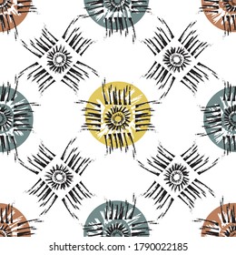 Vector tribal motifs seamless pattern background. Backdrop of grunge style sun symbol within square frayed brush stroke frames. Midcentury color and ethnic design repeat. Blockprint handmade feel.