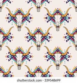 Vector tribal seamless pattern with bull skull and decorative ethnic ornament. Boho style. American indian motifs.