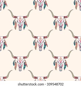 Vector tribal seamless pattern with bull skull and ethnic feathers. Boho style. American indian motifs.