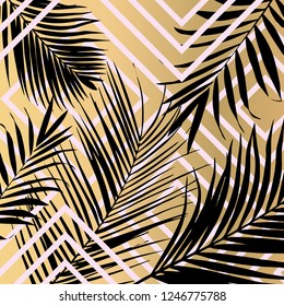 Vector tropical palm leaves on gold background