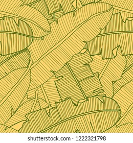 Vector tropical seamless pattern with banana leaves. Exotic plants in yellow color. Hand drawn textile print.