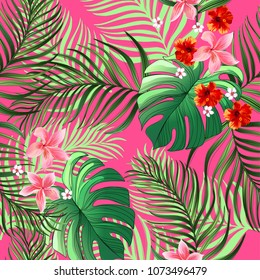 Vector tropical seamless pattern with hibiscus flowers and palm leaves.