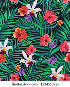 Vector tropical seamless pattern with hibiscus flowers and palm leaves.