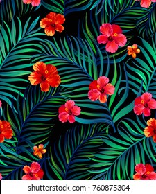 Vector tropical seamless pattern with hibiscus flowers and palm leaves.