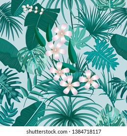 Vector tropical seamless pattern in Quetzal Green colors. Botany design, jungle leaves of palm tree and flowers.