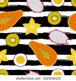 Vector tropical seamless pattern with stripes and exotic sliced ??fruits: papaya, kiwi, pitaya, carambola, passion fruit. Trendy summer design for textile, poster, banner, print