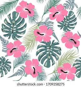 Vector tropical trendy seamless pattern with exotic plant leaves and hibiscus flowers.