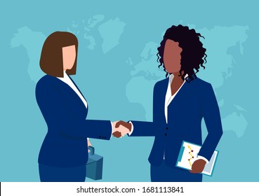 Vector of two businesswomen shaking hands isolated on world map background. 