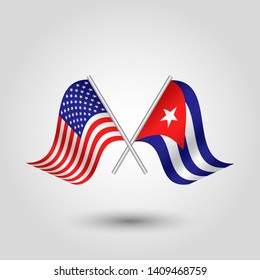 vector two crossed american and cuban flags on silver sticks - symbol of united states of america and cuba