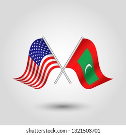 vector two crossed american and maldivian flags on silver sticks - symbol of united states of america and maldives