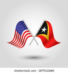 vector two crossed american and timorese flags on silver sticks - symbol of united states of america and east timor