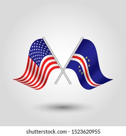 vector two crossed american and verdean flags on silver sticks - symbol of united states of america and cape verde