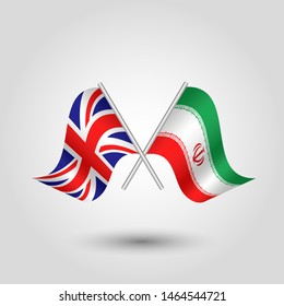 vector two crossed british and iranian flags on silver sticks - symbol of united kingdom and iran