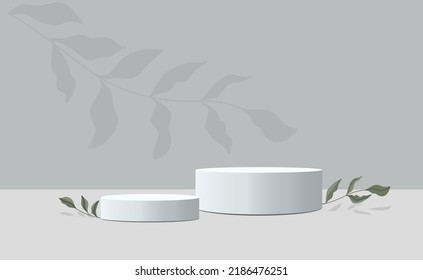 vector of two empty podiums for product presentation. gray podiums on a gray background with green leaves