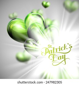 vector typographical illustration of handwritten Saint Patrick's Day label on the holiday background of flying green balloon hearts and shiny burst or explosion.  holiday lettering composition