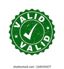 Vector Valid grunge stamp seal with tick inside. Green Valid watermark with grunge texture. Round rubber stamp imprint.
