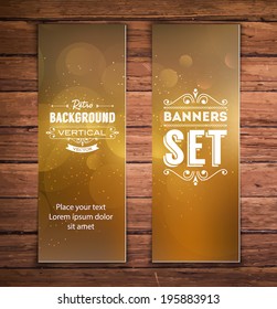 Vector vertical banners with golden blurry glittering bokeh background