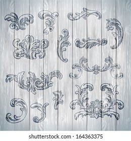 Vector vintage baroque engraving floral scroll filigree design on wood texture