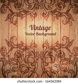 Vector vintage baroque engraving floral scroll filigree design on wood texture