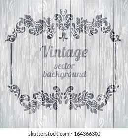Vector vintage baroque engraving floral scroll filigree design on wood texture