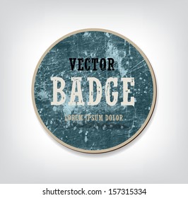 Vector vintage blue round weathered cardboard badge
