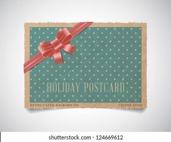 Vector vintage dotted paper card template with a pink silky ribbon bow knot