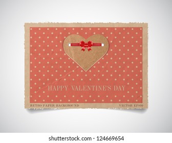 Vector vintage dotted paper valentine's day greeting card template with a cardboard heart attached with silky ribbon