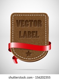 Vector vintage leather badge with red silky ribbon