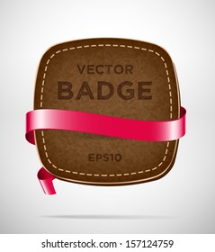 Vector vintage leather badge with red silky ribbon