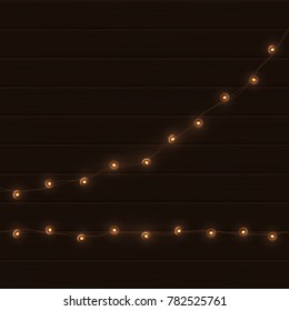 Vector vintage light garland on brown wooden background.