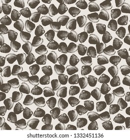 Vector vintage nautical seamless pattern with brown imprints of seashells on the light background.