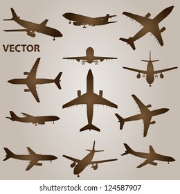 Vector vintage old set of brown planes drawings on a beige background. It is a group or collection of aircrafts ideal for grungy, travel, flight,transport,retro,antique,business or commercial designs