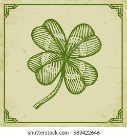 Vector vintage poster with clover for Patrick's day. Green clover on old paper and vintage frame.