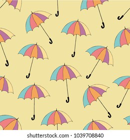Vector vintage seamless pattern with colorful umbrellas on a light lemon background, hand drawn illustration, doodle stule