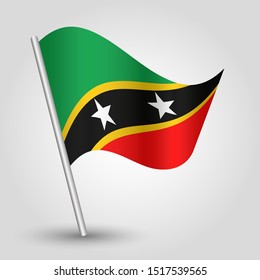 vector waving simple triangle kittian and nevisian flag on slanted silver pole - symbol of saint kitts and nevis with metal stick - anglo america