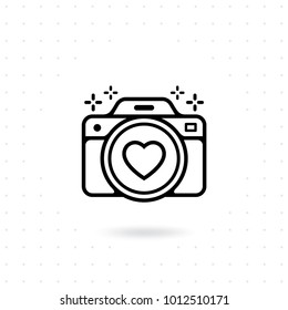 Vector for web and mobile applications. Photo camera outline vector icon. Camera icon with a heart symbol on the lens. Photography Vector illustration