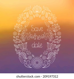 Vector wedding invitation card in floral frame and text save the date on blurred background