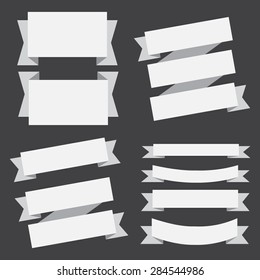 vector white banners ribbons set on a black background.