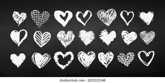 Vector white chalk drawn collection of grunge Valentine hearts on blackboard background.