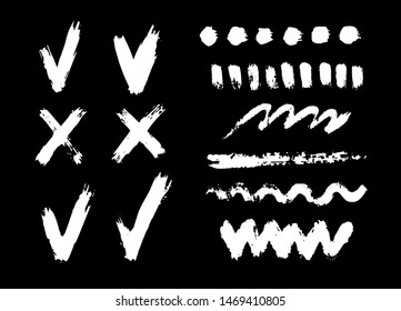 Vector white check marks,crosses,strokes,spots and drops  isolated on black background.Ink and paint  textures set.Grungy hand drawn elements for your design