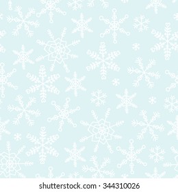 Vector white hand drawn snowflakes on blue background winter seamless pattern