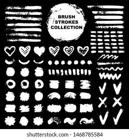 Vector white ink and paint  textures set of strokes,check marks,crosses,spots,circle frames,drops,stains,hearts and dashes.Grungy hand drawn elements for your design isolated on black background